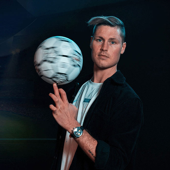 Football freestyler Tobias Becs spinning a ball while wearing a Von Doren watch.